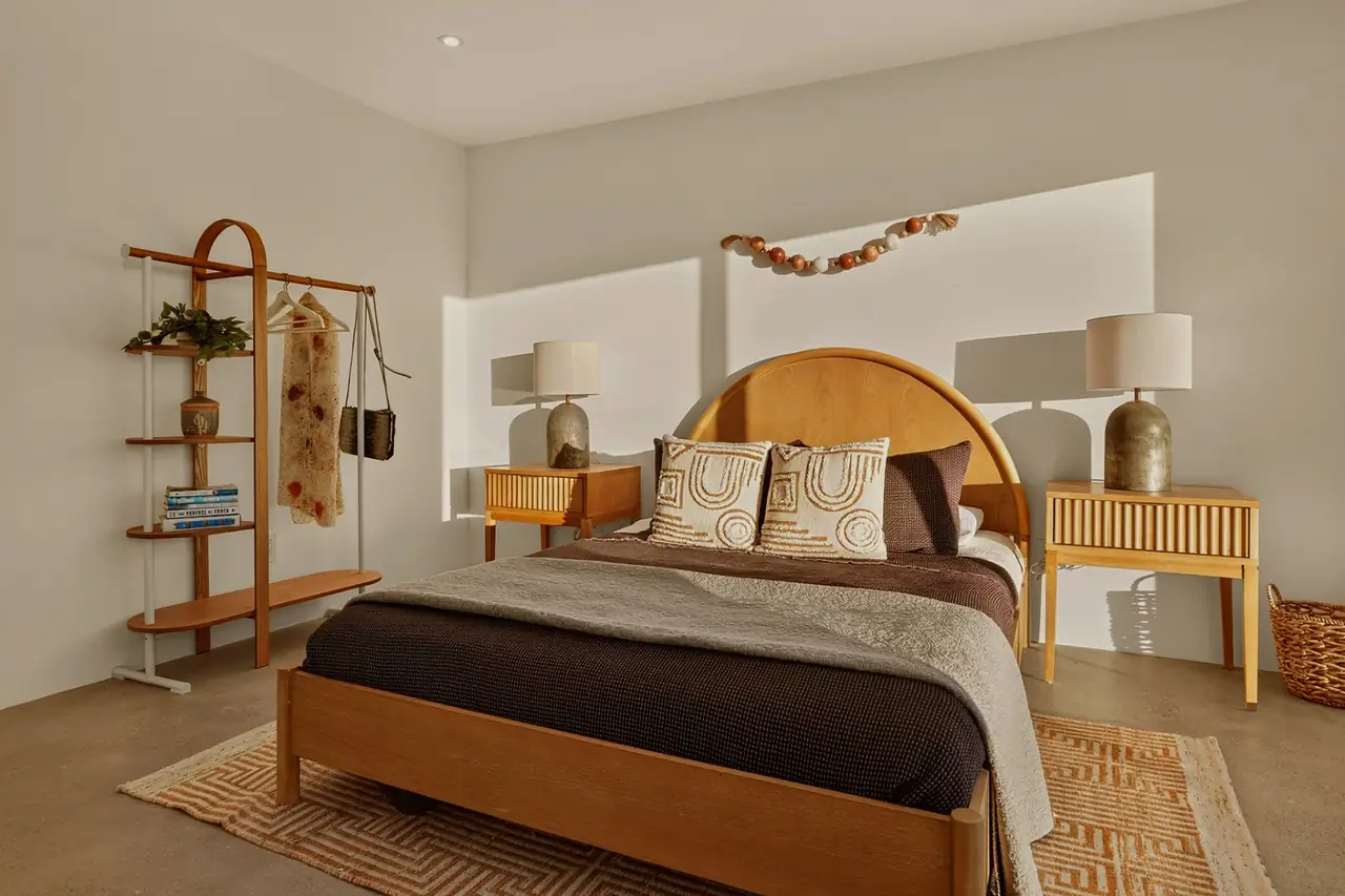 Guest bedroom with arched headboard