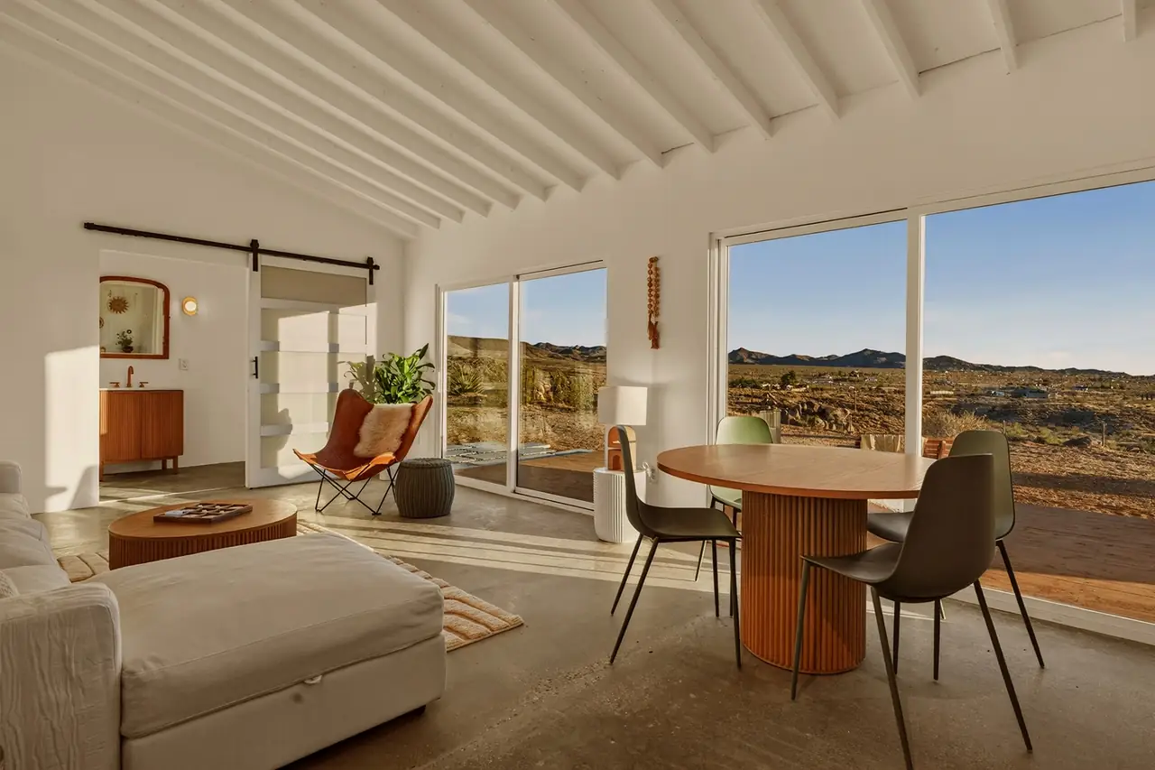Casita living room with open sliders framing desert