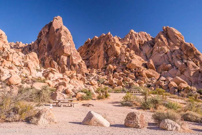 Indian Cove rock formations in Joshua Tree National Park under a deep blue sky