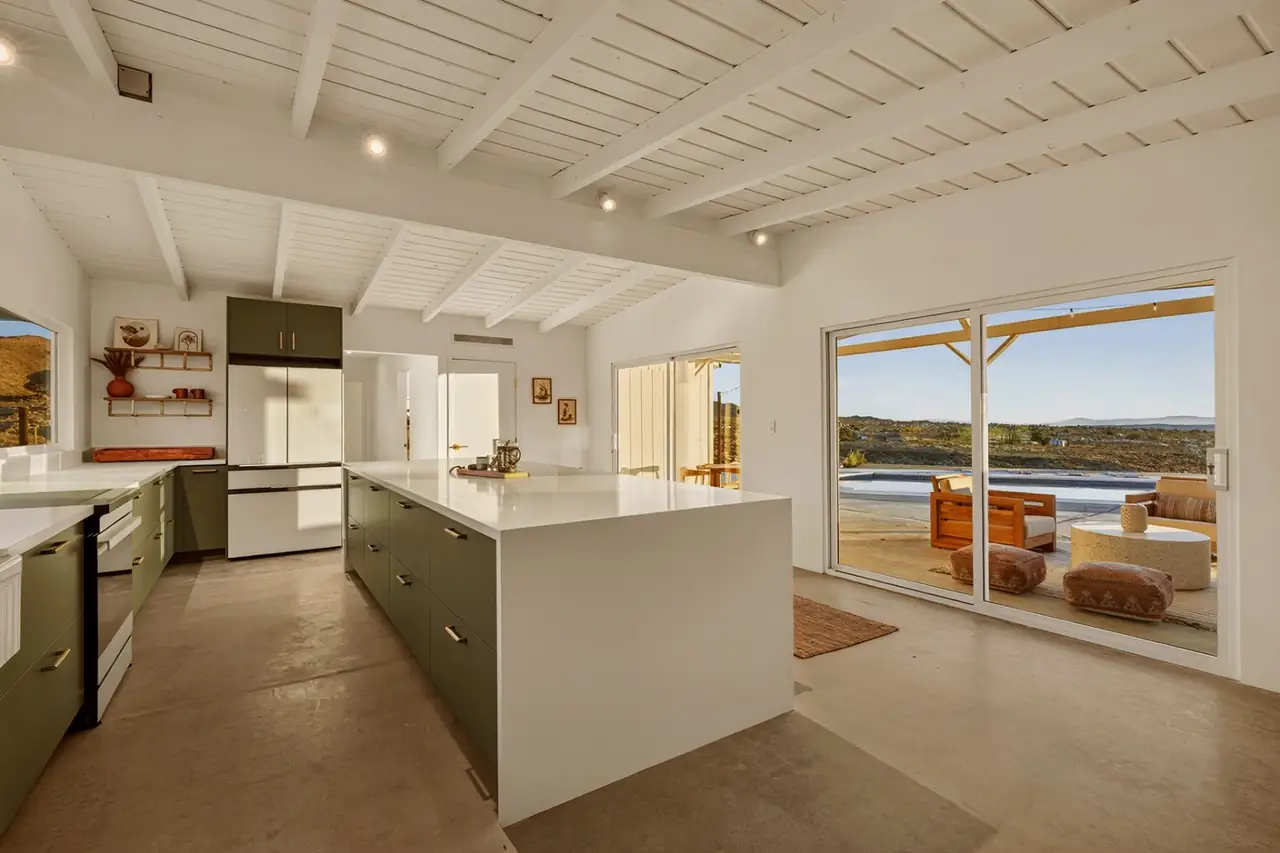 Kitchen opening to the poolside patio